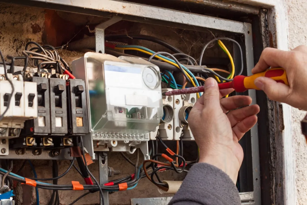 Repair,Of,Old,Electrical,Switchgear.,An,Electrician,Replaces,Old,Electrical Electrical switchgear repair